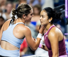 Alexandra Eala and Caty McNally sharing a moment at the net