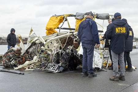 NTSB investigators examining the wreckage of the NYC helicopter crash