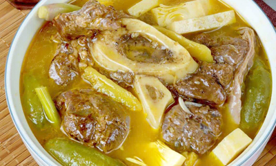 Photos of Kansi or sour soup made with beef shanks and green jackfruit, and flavored with batwan.